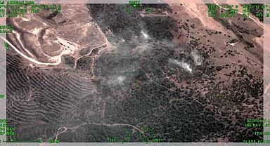 İzmir Kiraz'da tarlada başlayıp otluk ve bozuk ormana sıçrayan yangın kontrol altına alındı