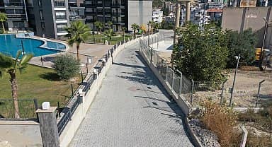 Kuşadası Belediyesi Değirmendere Mahallesi'ne 9 bin metrekare yeni yol yapıyor