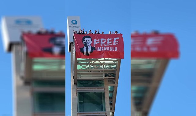 Antalya’da milletvekilleri, kent merkezine “Free İmamoğlu” yazılı pankart astı